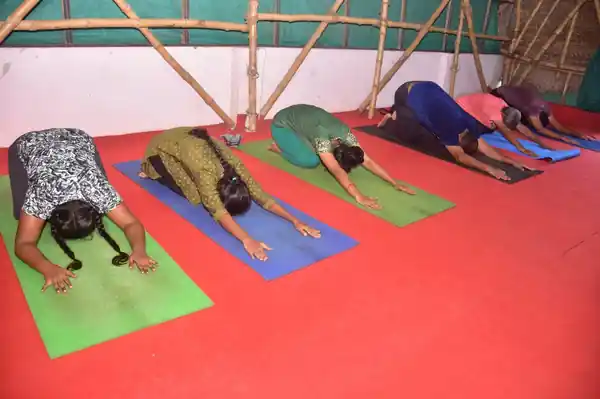 Students resting in child's pose