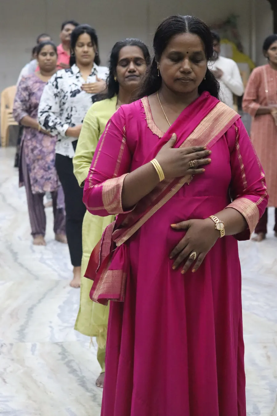 Aanantha Yoga members in a mindful breathing practice